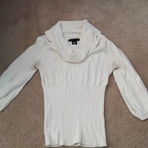 Cream colored sweater.